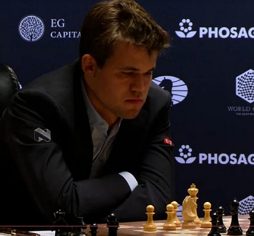 Chess world champion Magnus Carlsen, of Norway, studies the board
